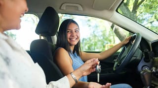Teen girl in the drivers seat of a vehicle wi.width kDNtfu.jpg