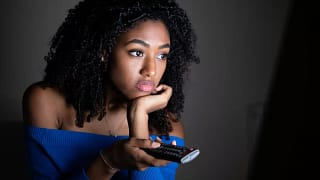 Woman watching tv VhCTBf.width .jpg