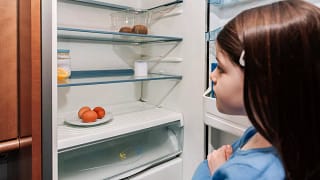 Young girl opening up refrigerator to find it.width pkLQBCv.jpg