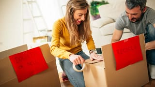 couple organizing boxes to recycle or donate .width wFcgDhz.jpg