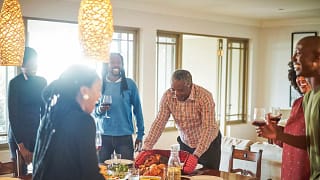 family at Thanksgiving table jIYUm.width .jpg