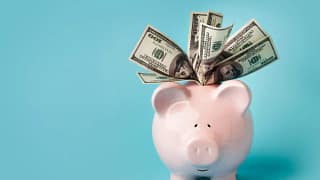 gettyimages overstuffed piggy bank.jpeg