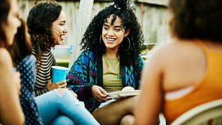 group of friends sitting outdoors LThJL.width .jpg