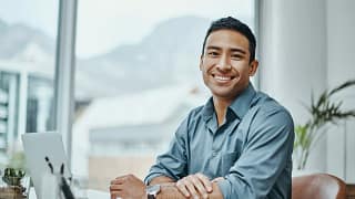 man s or s smiling laptop gettyimages .jpg