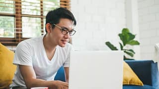 man on couch with laptop.width .jpg
