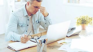 mature man frustrated upset sitting in front of computer.jpg