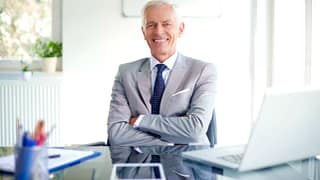 older man suit smiling gettyimages .jpg