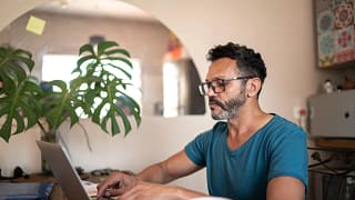 person using a laptop at home.jpg