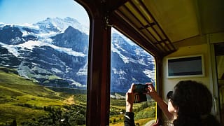 person taking photo from train lZqef.width .jpg