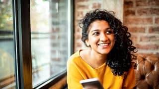 smiling person with phone.jpg