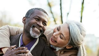 two older people hugging and smiling.jpg
