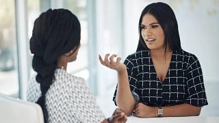 two people in office meeting PhJFen Qyrder.width .jpg