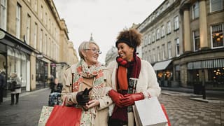 two women with shopping bags lkADAB.width .jpg
