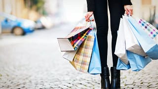 woman holding shopping bags fxHEe.width .jpg