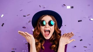 young woman celebrating confetti JJKEH.width .jpg