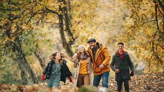 Family enjoys fall foliage in forest MiTiAHm.width .jpg