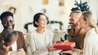 Friends exchanging Christmas gifts ukAkVf.width .jpg