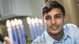Hanukkah family celebrate Jewish holiday meno.width .jpg