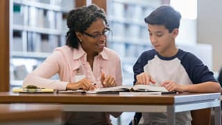 Tutor working with student SRTstck.width .jpg
