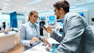 Woman browsing in electronics store SRIkgQD.width .jpg