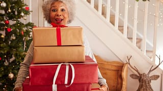 Woman holding gifts LYQJxI.width .jpg