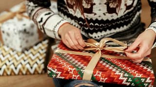 Woman wrapping gifts TpmzY.width .jpg