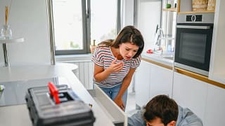 Young couple inspecting drawers with toolbox .width oyChuc.jpg