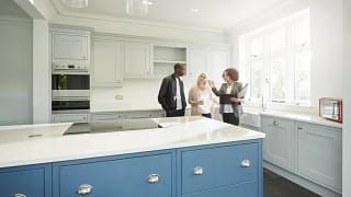 couple with realtor in new home.width HfKaAGb.jpg