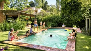 family in backyard pool zlntaK.width .jpg