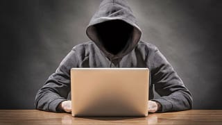 hacker in hoodie identity theft cyber securit.width RckAyD.jpg