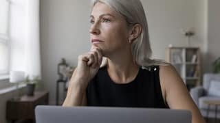 older woman laptop thoughtful gettyimages .jpg