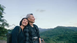 smiling senior couple out hiking.jpg