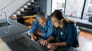 two individuals looking at laptop.jpg