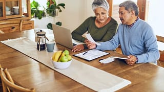 two people sitting at a table looking at paperwork.jpg