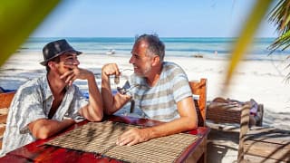two people at beachside table TMuBhy.width .jpg