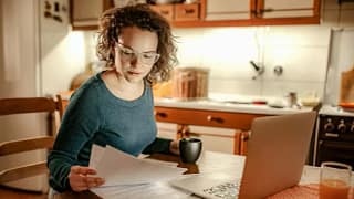 woman with bills and computer.width .jpg