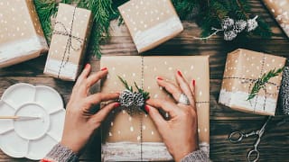 womans hands wrapping gifts.width .jpg