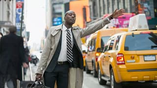 Businessman hailing a cab in the city OhTGMP.width .jpg