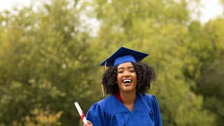 College grad in cap and gown Izqq.width rUZpZKR.jpg