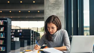 Female college student studying library.width .jpg
