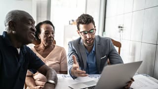 Senior couple meets with male professional. y.width .jpg