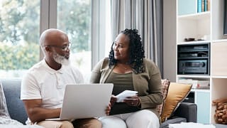 Senior couple sitting on couch together going.width Qvmomn.jpg