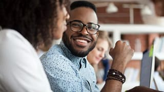 Smiling coworkers in office RLpfY.width .jpg