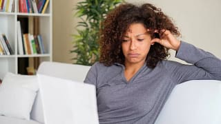 Stressed woman with paperwork dJzqjv.width .jpg