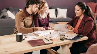 Young couple meets with professional woman v.width .jpg