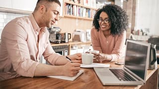 couple go over personal finances oyLcmHJ.width .jpg