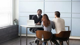 couple meeting with bank representative.width bJjKj.jpg