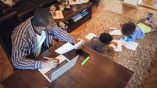 dad working from home watching kids.width .jpg