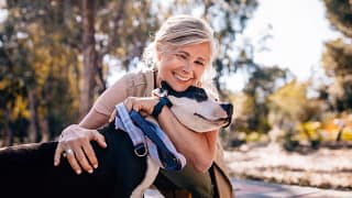 getty happy with a dog smiling.jpg