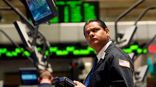 getty images man on the floor of a stock exchange.jpeg